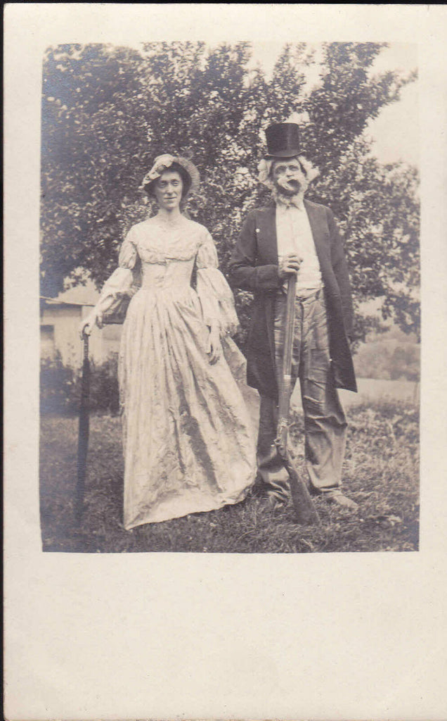 Man w Gun & Fake Beard Posing RPPC Postcard Woman w Umbrella